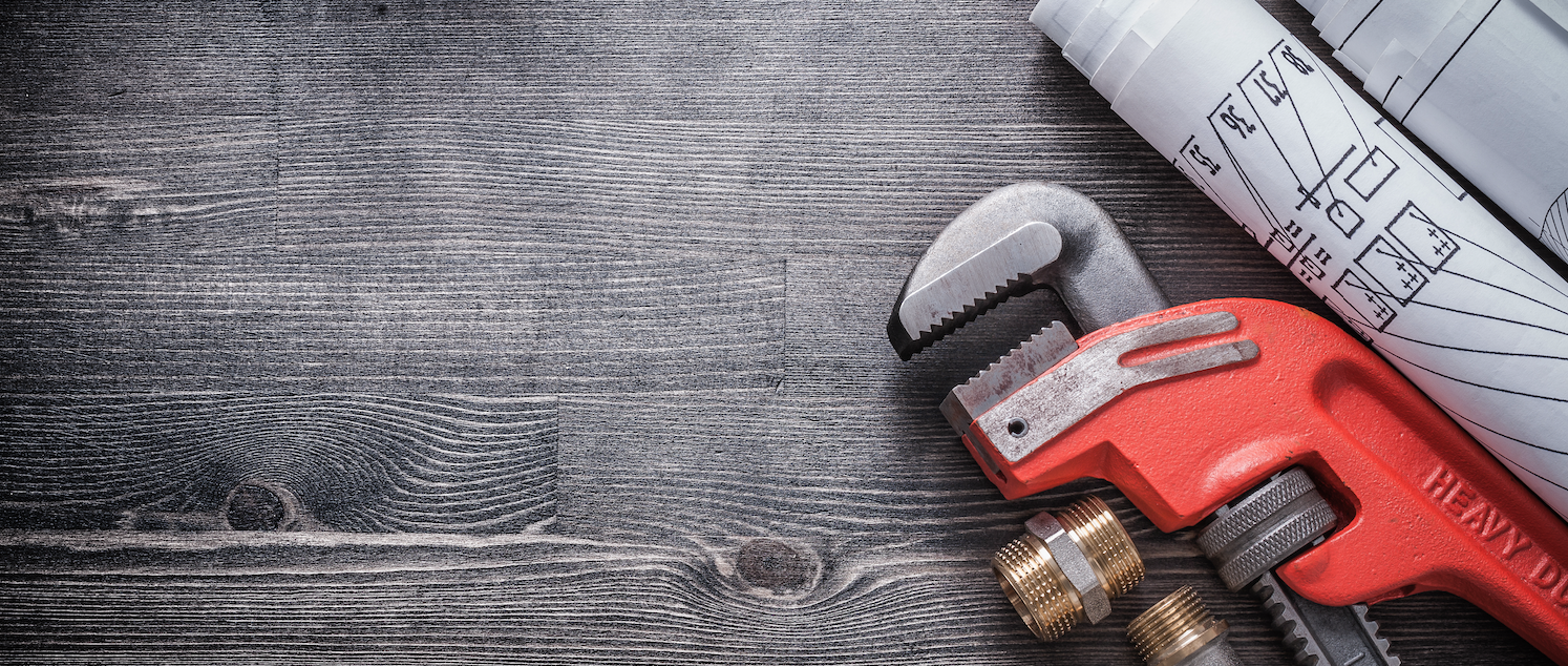 Plumbing tools and blueprints